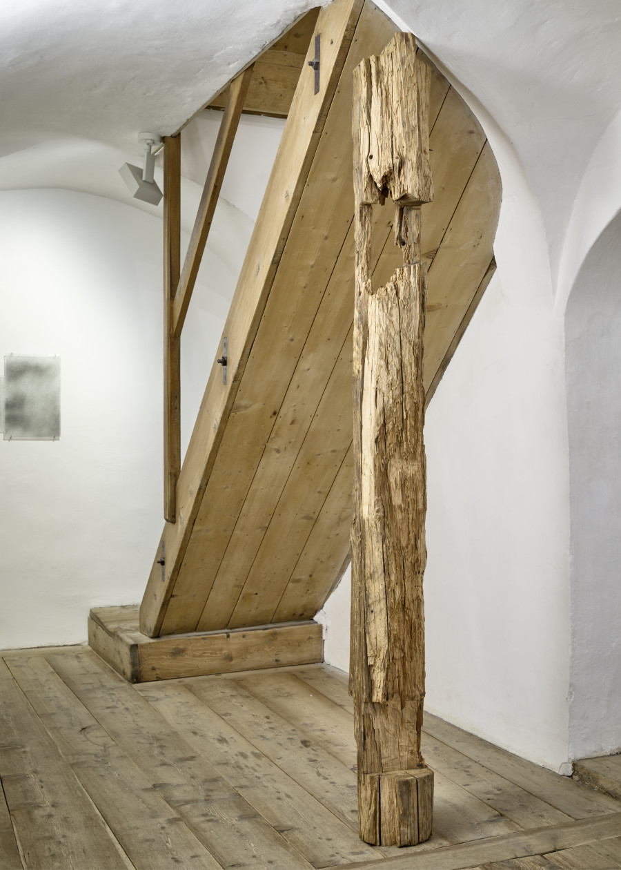 Exhibition view, Augustas Serapinas, Part of the House from Skirgiškės, 2022, reclaimed wood, 237 x 24 x 23 cm. Photo: Ralph Feiner, Courtesy of the artist and Galerie Tschudi