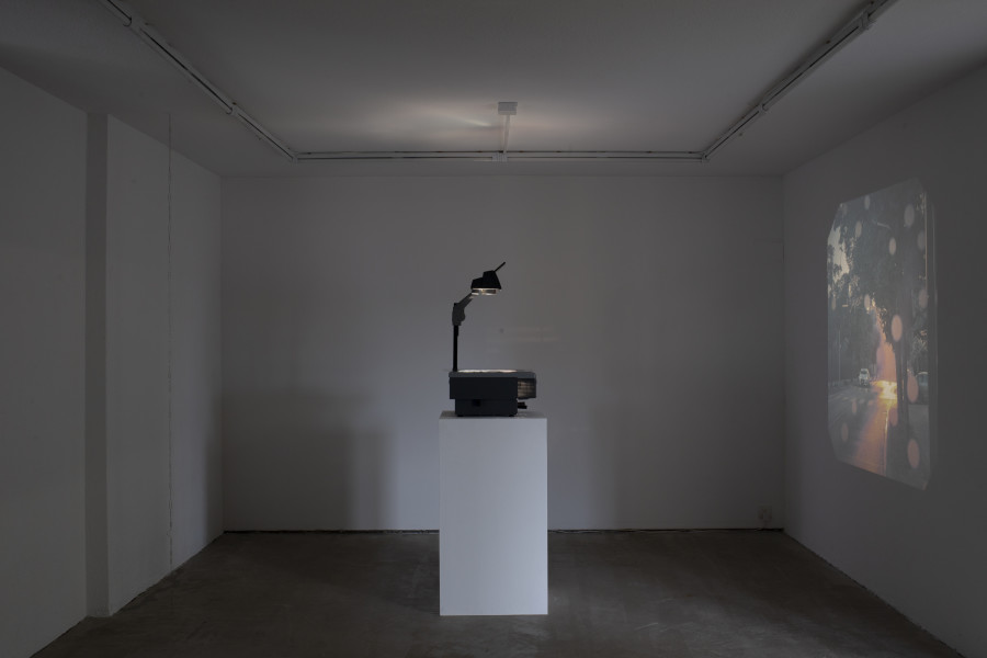 Exhibition view, Memory Mold, HAMLET, 2024. From left to right: Luca Büchler, Bracket (IV), 2024, (); Medjid Sopi, Front Seat, 2024, Digital print on PVC (A3), overhead projector. Photo by Leevi Toija