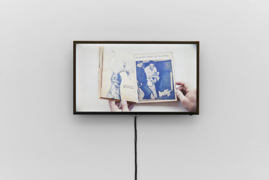 Installation view, Bizarre Silks, Private Imaginings and Narrative Facts, etc., an exhibition by Nick Mauss, view on video documentation of Ray Johnson’s artist book Ray Gives a Party, ca. 1955, Kunsthalle Basel, 2020. Photo: Philipp Hänger / Kunsthalle Basel