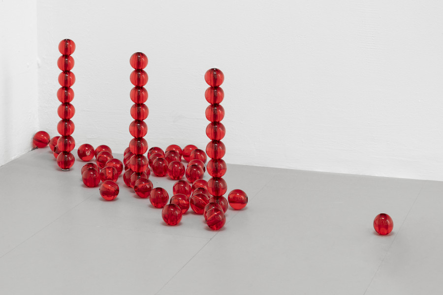 Detail of Clara Roumégoux, Red beads, 2023. Beads (acrylic, metal), Variable dimensions. Courtesy of the Artist and La Rada, Locarno. Photography by Riccardo Giancola