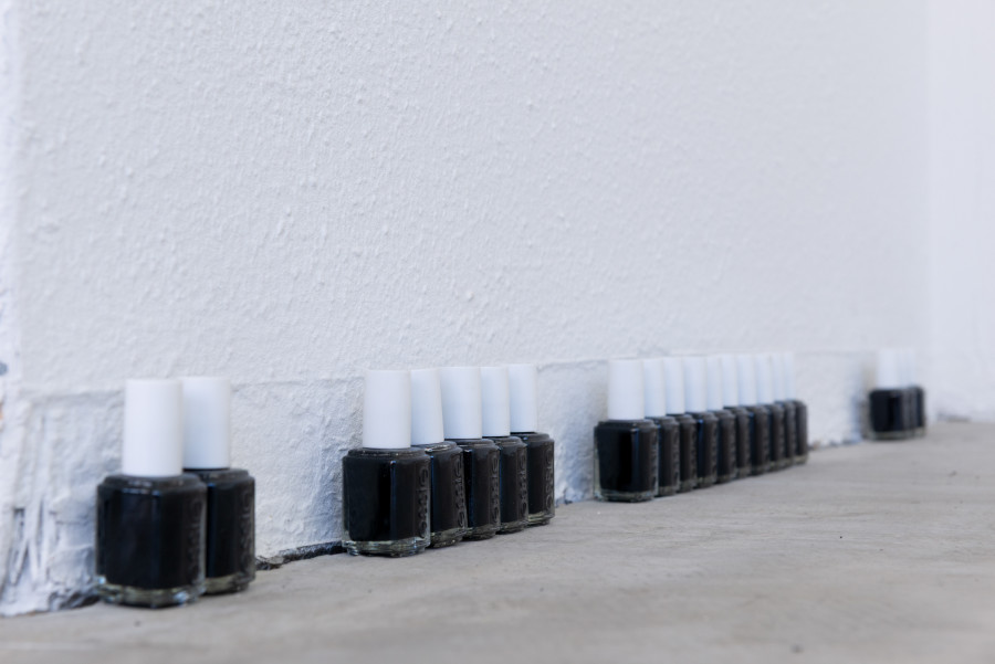 Exhibition view, Moniker, HAMLET, Zürich, 2025. Gaia Del Santo, black essie series, 2024 - ongoing, 48 Essie nail polishes with individual titles (difference, repetition; high fashion, post-fordism, ego death, style, object; contempo-casual, chance, desire, subject-centered inquiry, eye, vanish into you, perfect celebrity, snapchat surgery, copyright, archetype; matcha shortage, flat lay, romanticism)