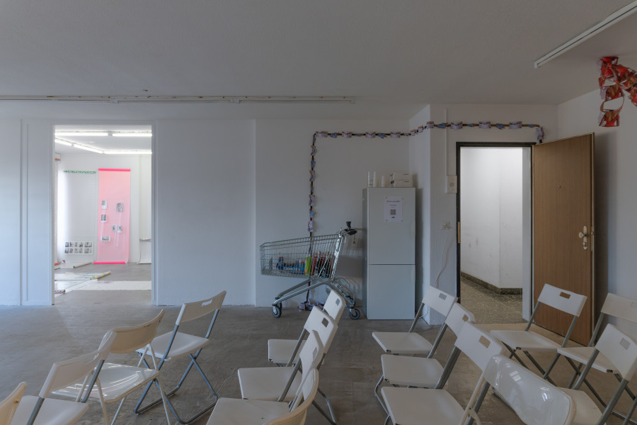 Exhibition view, Sven Gex, celebratory, Halmet, Zürich, 2025. From left to right: Sven Gex, celebratory, 2025, gift wrapping paper, nails, glass, printed images from the ‚character fitting‘ series 2021-ongoing ; Sven Gex, garland for ‚celebratory‘ (holbein/mcqueen), 2025, hand cut printed pictures, staples, velvet ribbon ; Sven Gex, garland for ‚celebratory‘ (maid-of-all-work character), 2025, hand cut printed pictures, staples