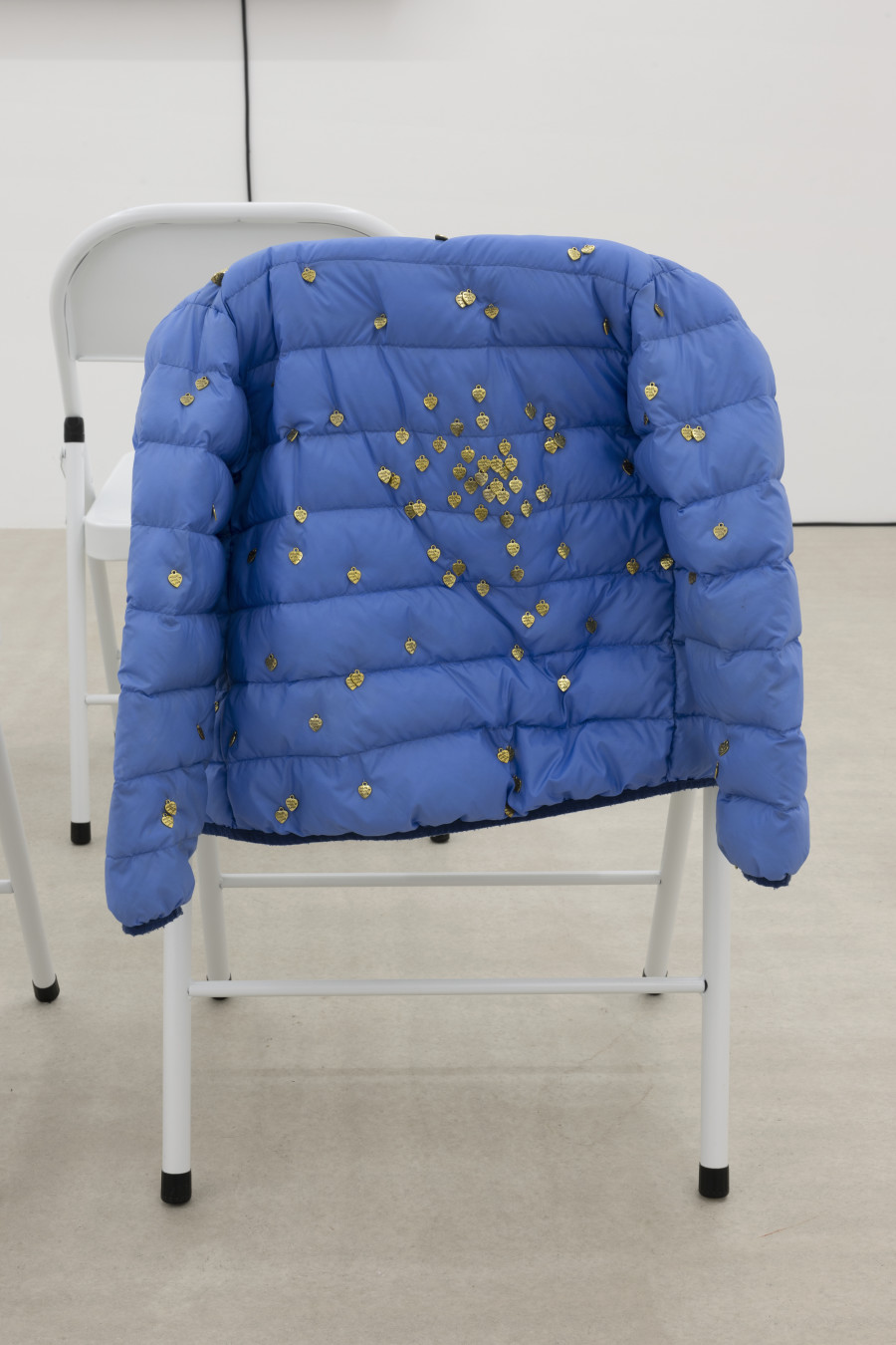 Teo Petruzzi, HAPPY FAMILY, 2023, puffer jackets, embroidery, heart pendants, 73 × 40 × 18 cm. Photography: Gina Folly / all images copyright and courtesy of the artist and For, Basel