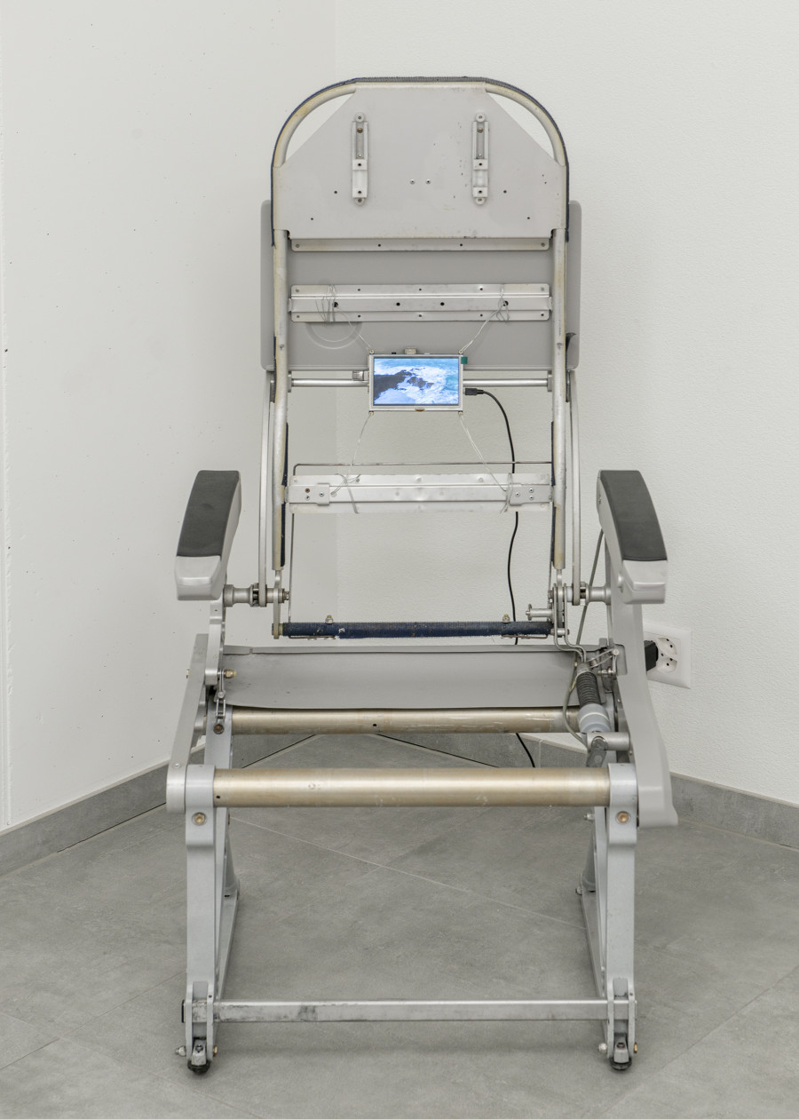 Rafik Greiss, Left to my own devices, 2021, airplane chair with video on LCD screen — Picture © Simon Rimaz