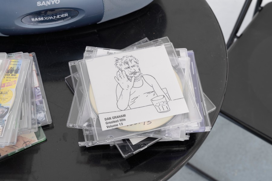 Dan Graham, Dan Graham’s Greatest Hits, Volume 1 - 21 + The Kinks (detail), 2004–2022/2025, 22 compact discs and inkjet prints, Courtesy of The Dan Graham and Mieko Graham Foundation. Photo credits: marytwo