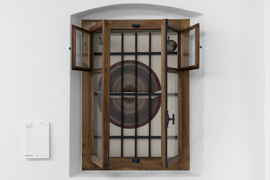 Salomé Engel, Substantive Revolutions, 2025, Sand paper, quartz stone disk, window, 137 × 99 × 53cm. Photo credits: marytwo