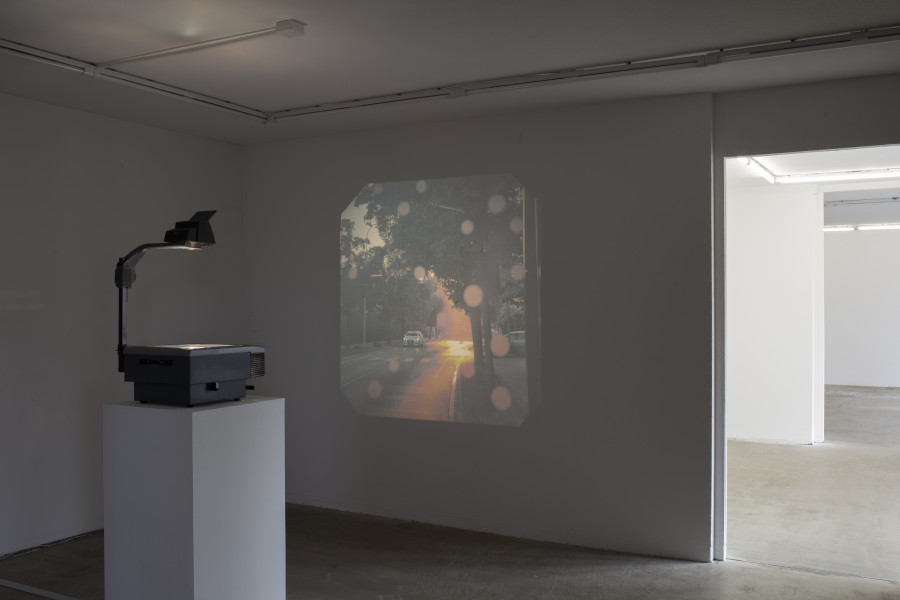 Exhibition view, Memory Mold, HAMLET, 2024. Medjid Sopi, Front Seat, 2024, Digital print on PVC (A3), overhead projector. Photo by Leevi Toija