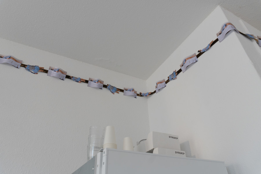 Exhibition view, Sven Gex, celebratory, Halmet, Zürich, 2025. Sven Gex, garland for ‚celebratory‘ (holbein/mcqueen), 2025, hand cut printed pictures, staples, velvet ribbon