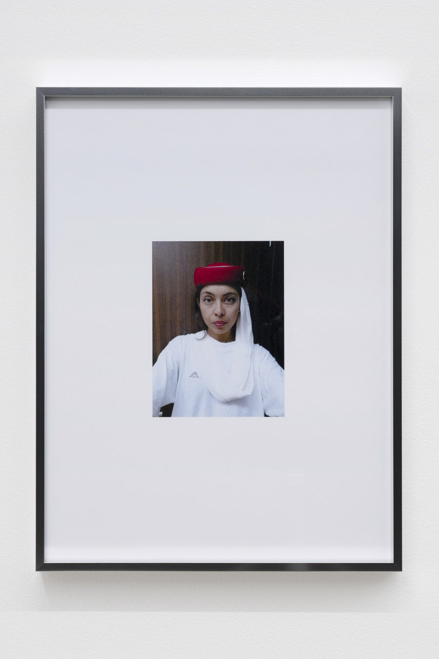 Mati Jhurry, duty free_Emirates Staff No.460596, 2025, Series of 9 photographs pulled from the archive of performance Emirates Staff no. 460596, digital print on paper, aluminium frame, 31 × 41 × 2 cm each. Photography: Gina Folly / all images copyright and courtesy of the artists and For, Basel