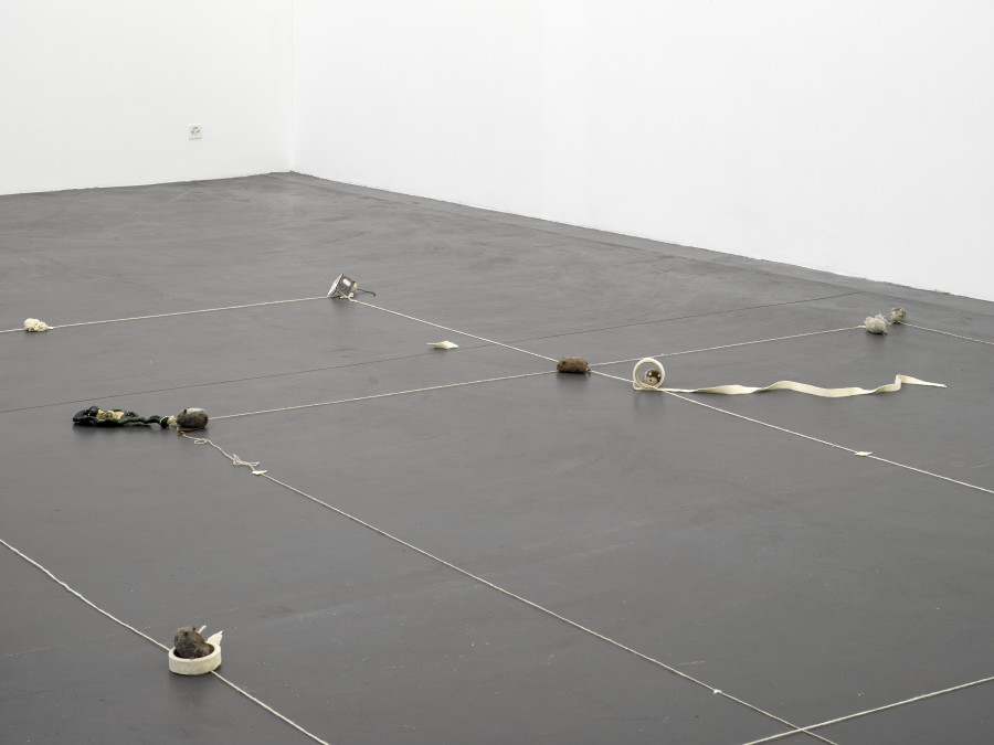 Min Yoon, Floor + ing Plan B + ing, 2024, Wool felt, thread, recycled glass bottles, Dimensions variable. Photo: Cedric Mussano