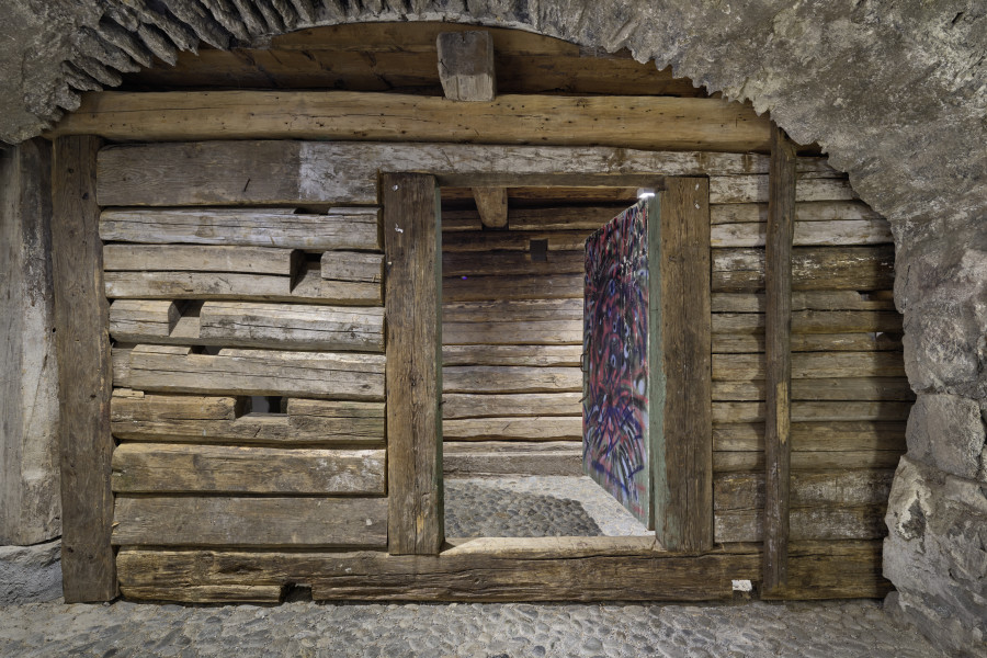 Exhibition view, Augustas Serapinas, House Wall from Didžioji Kuosinė, 2022, reclaimed wood, 200 x 390 x 31 cm. Photo: Ralph Feiner, Courtesy of the artist and Galerie Tschudi