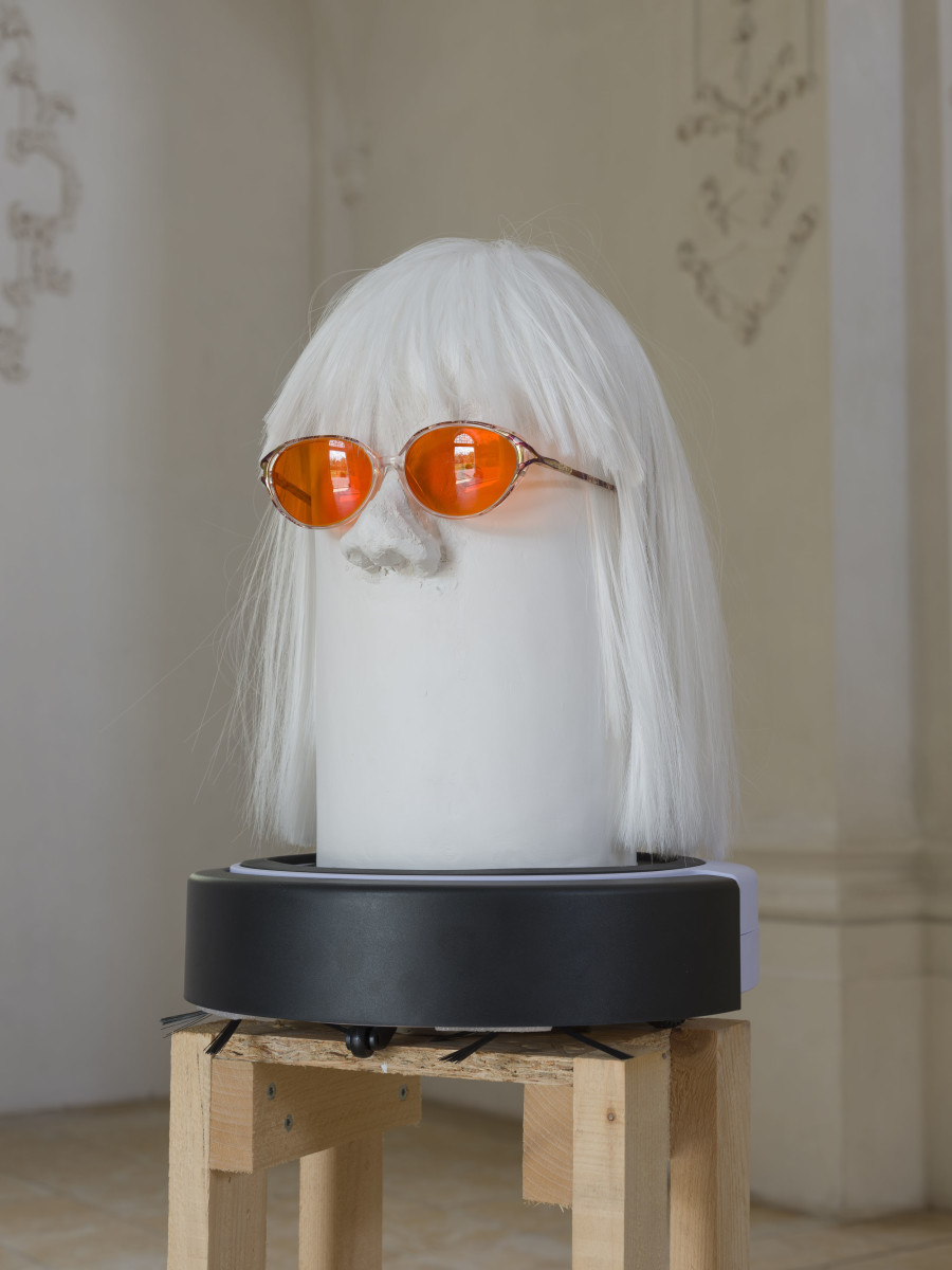 Benedikt Bock, What People Want is Not What People Need (Rebekka), 2023. Cardboard, plaster, clay, wood, wig, glasses, 175 x 35 x 35 cm. Photo credit: Sebastian Verdon / Abbatiale Bellelay