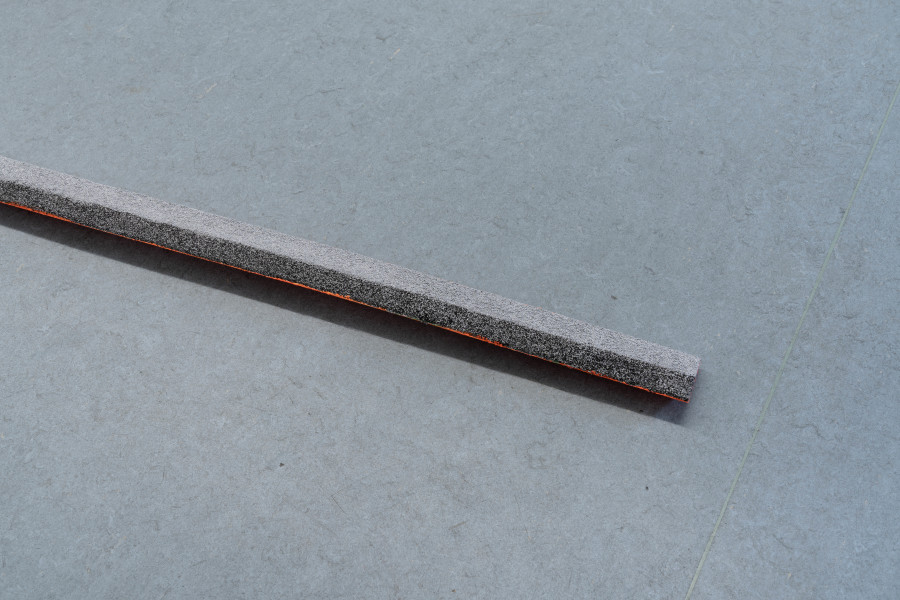 Salomé Engel, Needles: Insinuation of Sailing Motes I (detail), 2025, Metal debris, wood, laquer, coloured sand, 1028 × 60 × 23cm. Photo credits: marytwo