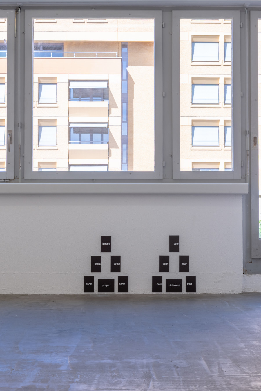 Exhibition view, Moniker, HAMLET, Zürich, 2025. From left to right: Noah Merzbacher, pyramid, 2025; Noah Merzbacher, pyramid, 2025, UV flatdbed print on dibond