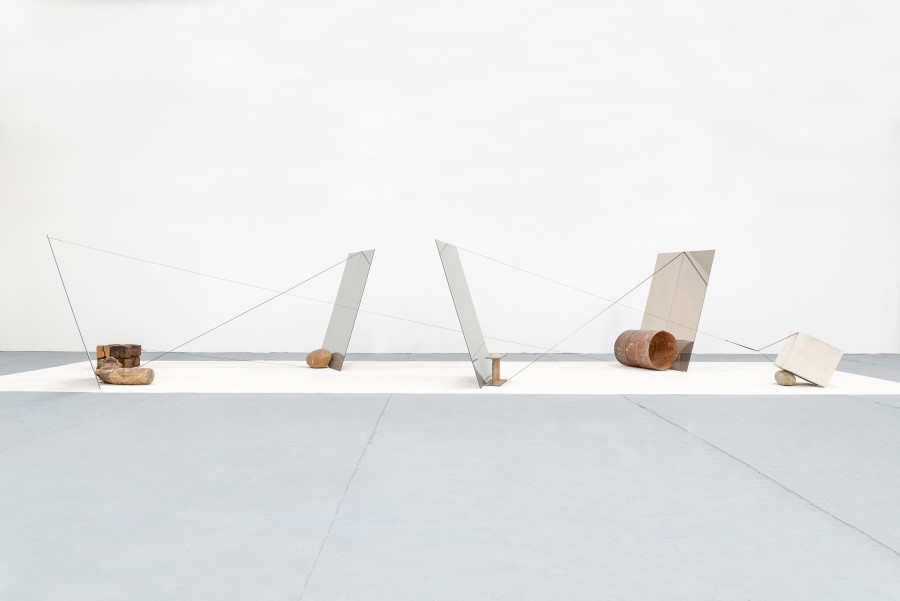 Jose Dávila, Will has moved mountains, 2020, One way mirror, wood, metal, concrete, boulder, and strap, 179.5 x 822 x 653.5 cm. Photo: Agustín Arce