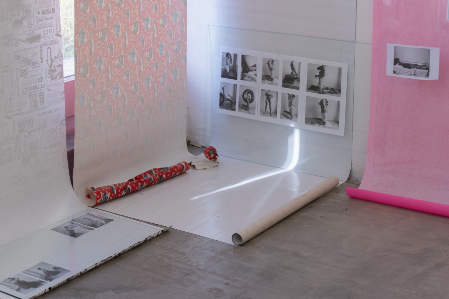 Exhibition view, Sven Gex, celebratory, Halmet, Zürich, 2025. Sven Gex, celebratory, 2025, gift wrapping paper, nails, glass, printed images from the ‚character fitting‘ series 2021-ongoing