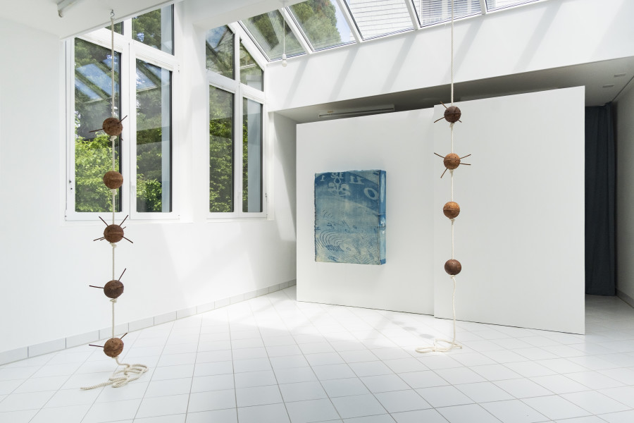 Maya Hottarek Positive discharge, Dimensions variables, ceramic, engobe, anti-stress encens sticks, cotton rope, metal, 2023 (on the right). Maya Hottarek, I C U, Dimensions variables, ceramic, engobe, anti-stress encens sticks, Cot- ton rope, metal, 2023 (on the left). Photo credit : Philip Frowein (@philipfrowein)